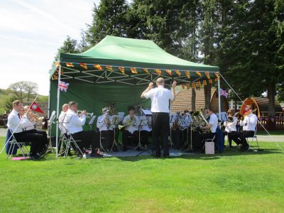 Band playing in marquee at Bellingham campsite